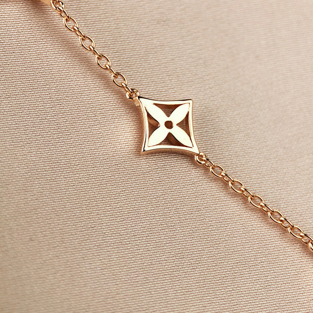 STAR AND SUN 7 MOTIFS GOLD BRACELET