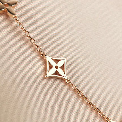 STAR AND SUN 7 MOTIFS GOLD BRACELET