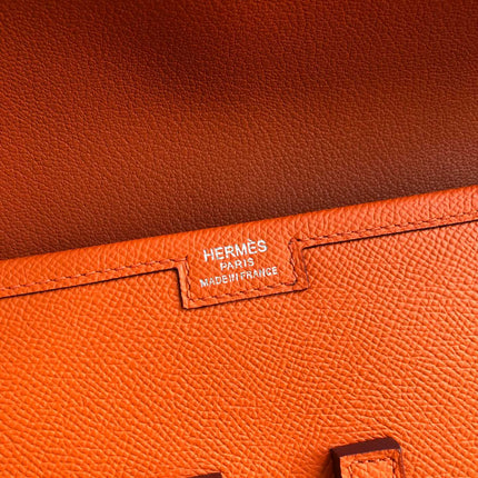 JIGE ELAN 29 CLUTCH IN SALAMANDER ORANGE CALFSKIN