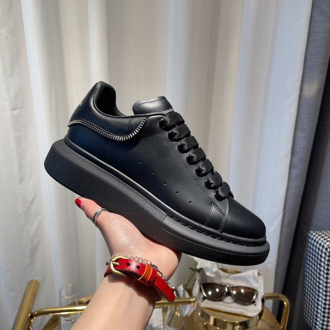 OVERSIZED SNEAKERS IN BLACK CALFSKIN WITH ZIPPER DETAIL AND SILVER LOGO HEEL