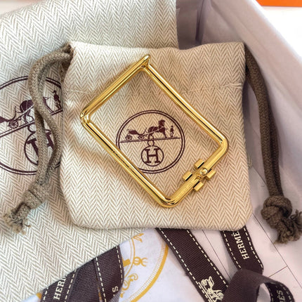 TUBE H BELT BUCKLE & REVERSIBLE BLACK AND CINNAMON BROWN LEATHER STRAP 38MM GOLD HARDWARE