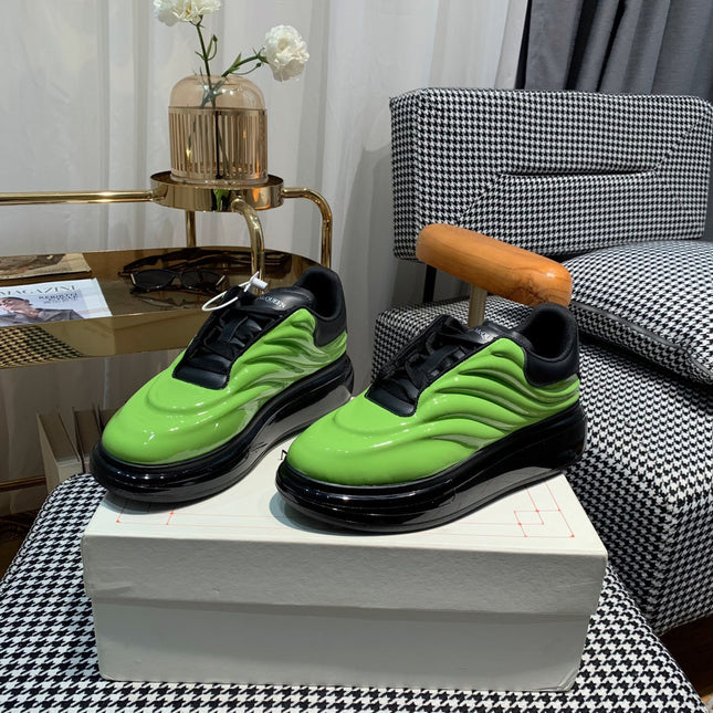 OVERSIZED SNEAKERS IN LIGHT GREEN SHINY CALFSKIN WAVE PATTERN AND BLACK SOLE