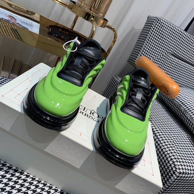 OVERSIZED SNEAKERS IN LIGHT GREEN SHINY CALFSKIN WAVE PATTERN AND BLACK SOLE
