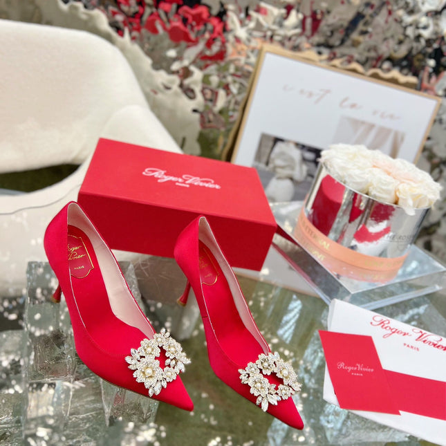 EFFLORESCENCE POINTED-TOE PUMPS IN RED SATIN WITH CRYSTAL BUCKLE