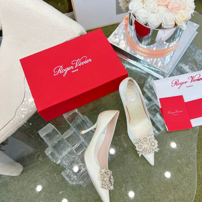EFFLORESCENCE POINTED-TOE PUMPS IN WHITE SATIN WITH CRYSTAL BUCKLE