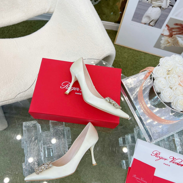 EFFLORESCENCE POINTED-TOE PUMPS IN WHITE SATIN WITH CRYSTAL BUCKLE