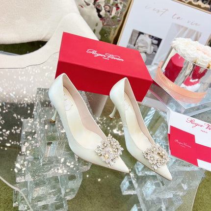 EFFLORESCENCE POINTED-TOE PUMPS IN WHITE SATIN WITH CRYSTAL BUCKLE