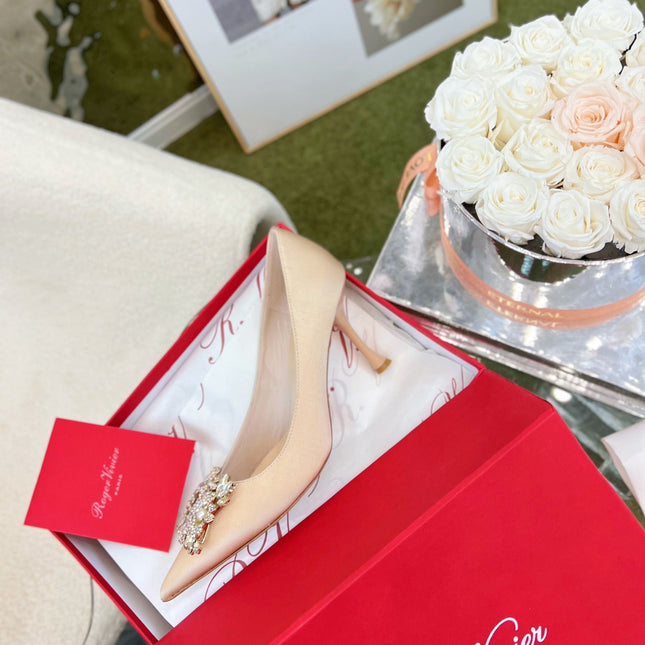 EFFLORESCENCE POINTED-TOE PUMPS IN NUDE SATIN WITH CRYSTAL BUCKLE