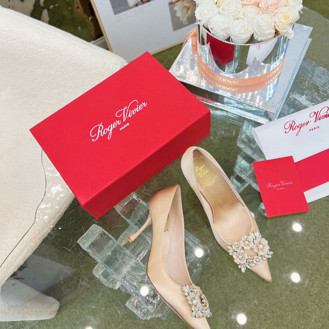 EFFLORESCENCE POINTED-TOE PUMPS IN NUDE SATIN WITH CRYSTAL BUCKLE