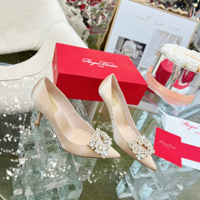 EFFLORESCENCE POINTED-TOE PUMPS IN NUDE SATIN WITH CRYSTAL BUCKLE