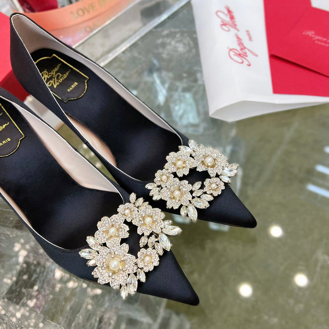 EFFLORESCENCE POINTED-TOE PUMPS IN BLACK SATIN WITH CRYSTAL BUCKLE