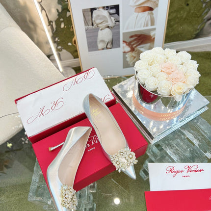 EFFLORESCENCE POINTED-TOE PUMPS 85MM IN SILVER SATIN WITH CRYSTAL BUCKLE