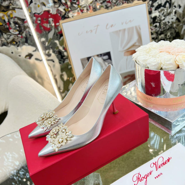 EFFLORESCENCE POINTED-TOE PUMPS 85MM IN SILVER SATIN WITH CRYSTAL BUCKLE