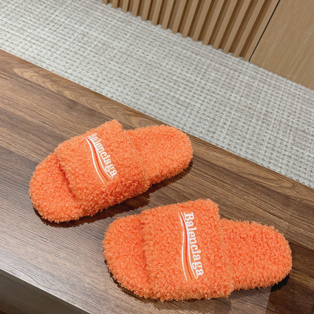 FURRY SLIDES IN ORANGE CURLY SHEARLING