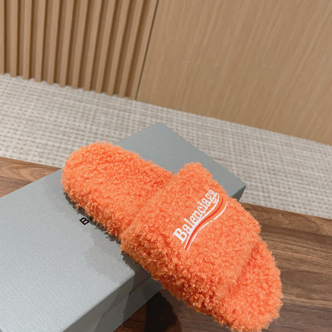 FURRY SLIDES IN ORANGE CURLY SHEARLING