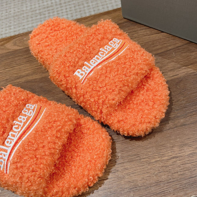 FURRY SLIDES IN ORANGE CURLY SHEARLING