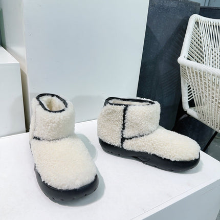 MINI ANKLE BOOT IN WHITE SHEARLING WITH BLACK ULTRA LIGHTWEIGHT RUBBER OUTSOLE