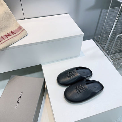 BALENCIAGA 25S MULES IN BLACK LAMBSKIN