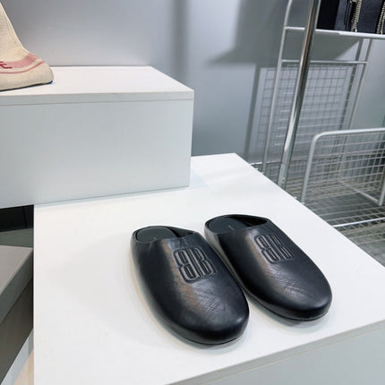 BALENCIAGA 25S MULES IN BLACK LAMBSKIN