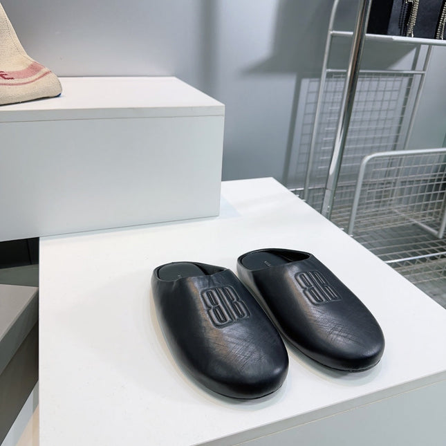 BALENCIAGA 25S MULES IN BLACK LAMBSKIN