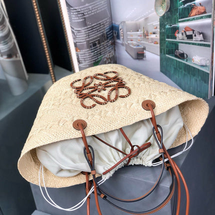 MEDIUM ANAGRAM BASKET BAG 46 IN BEIGE IRACA PALM AND TAN CALFSKIN