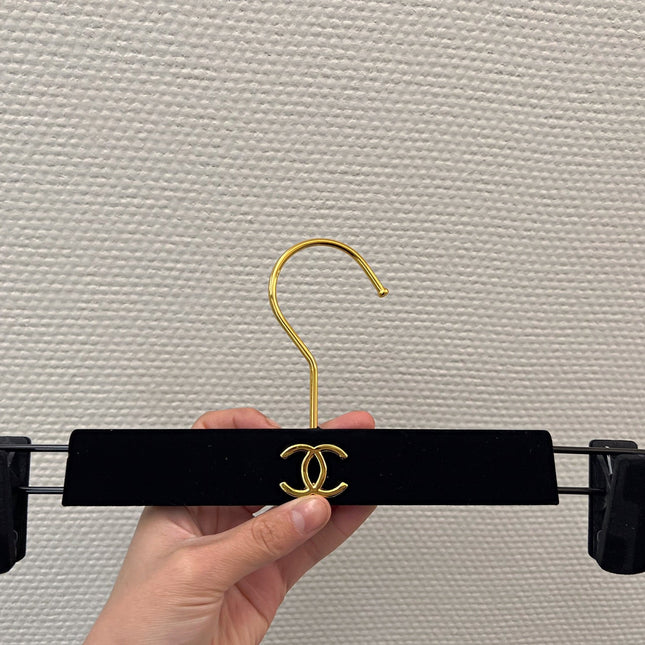 Chanel hanger's in black velvet and gold hardware