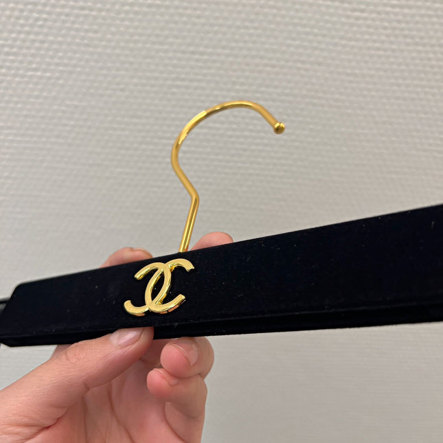 Chanel hanger's in black velvet and gold hardware