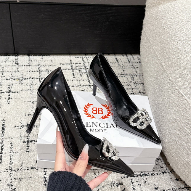 POINTED HIGH PUMPS IN BLACK PATENT CALFSKIN WITH CRYSTAL BUCKLE