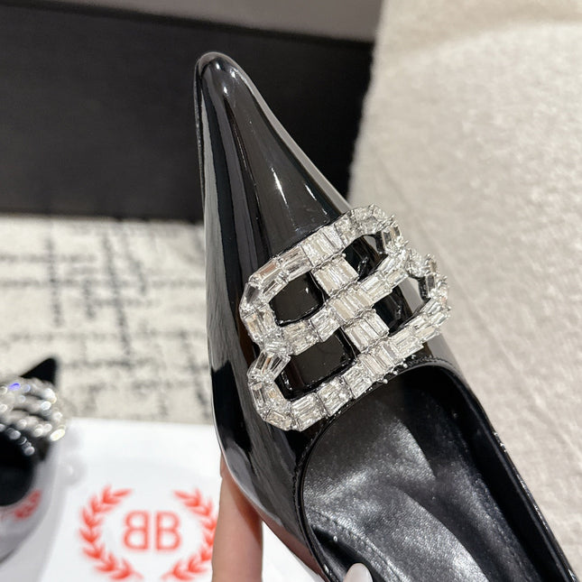 POINTED HIGH PUMPS IN BLACK PATENT CALFSKIN WITH CRYSTAL BUCKLE