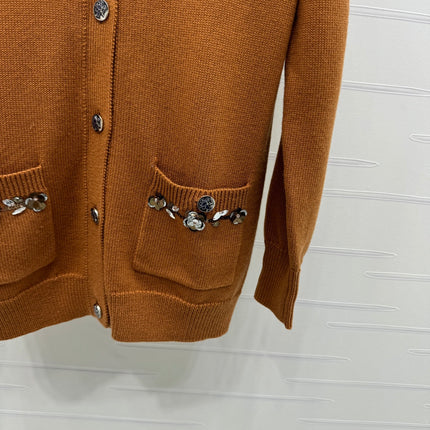 CHANEL HEAVY KNIT CARDIGAN WITH EMBELLISHED FLORAL DETAILS 274877