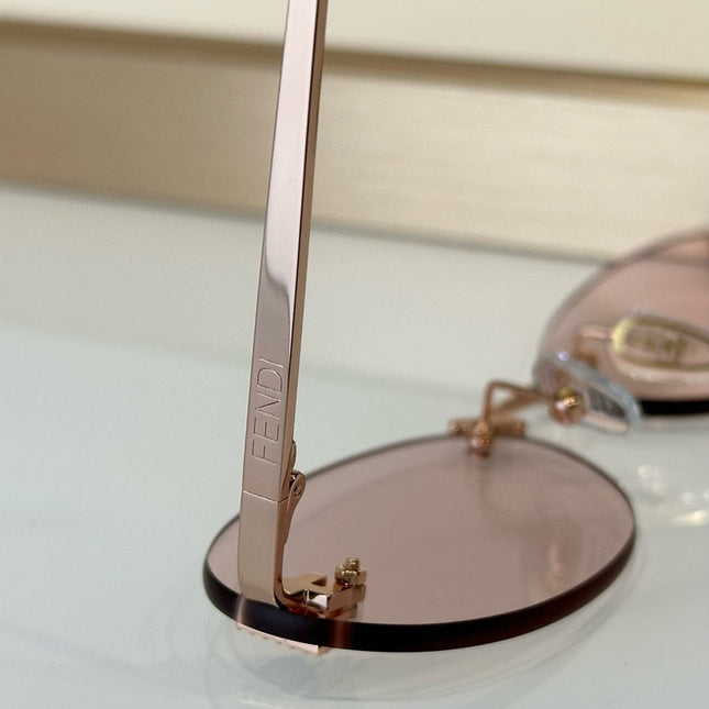 FIRST CRYSTAL RIMLESS OVAL FRAME SUNGLASSES FE4075US IN METAL