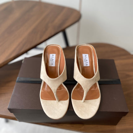 ALAIA WEDGE THONG SANDALS 25S IN LIGHT BEIGE SUEDE
