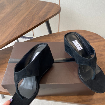ALAIA WEDGE THONG SANDALS 25S IN BLACK SUEDE