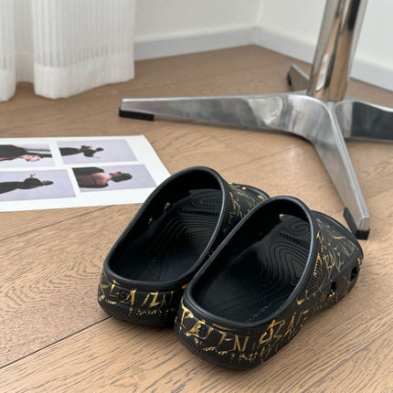 POOL GRAFFITI CROCS SLIDE SANDALS IN BLACK AND YELLOW RUBBER