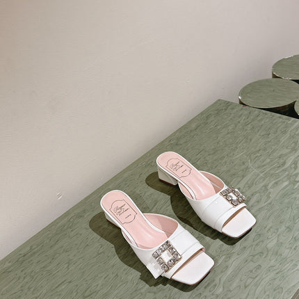 CRYSTAL HEEL MULE IN WHITE SHINY CALFSKIN WITH EMBELLISHED BUCKLE