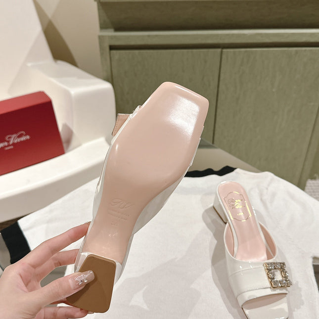 CRYSTAL HEEL MULE IN WHITE SHINY CALFSKIN WITH EMBELLISHED BUCKLE