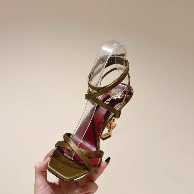 YSL 25S HIGH-HEEL SANDALS 100 MM IN MOSS GREEN SATIN WITH YSL LOGO HEEL DESIGN IN GOLD