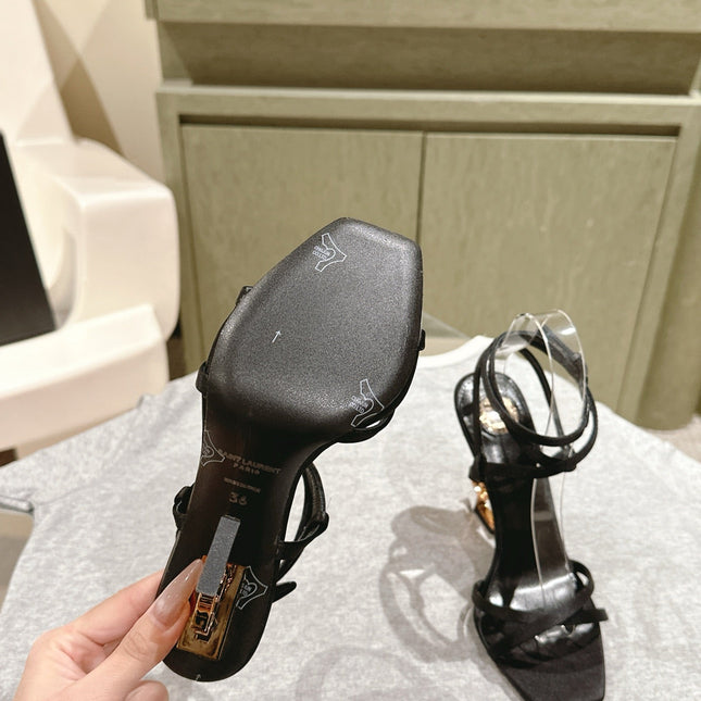 YSL 25S HIGH-HEEL SANDALS 100 MM IN BLACK SATIN WITH YSL LOGO HEEL DESIGN IN GOLD