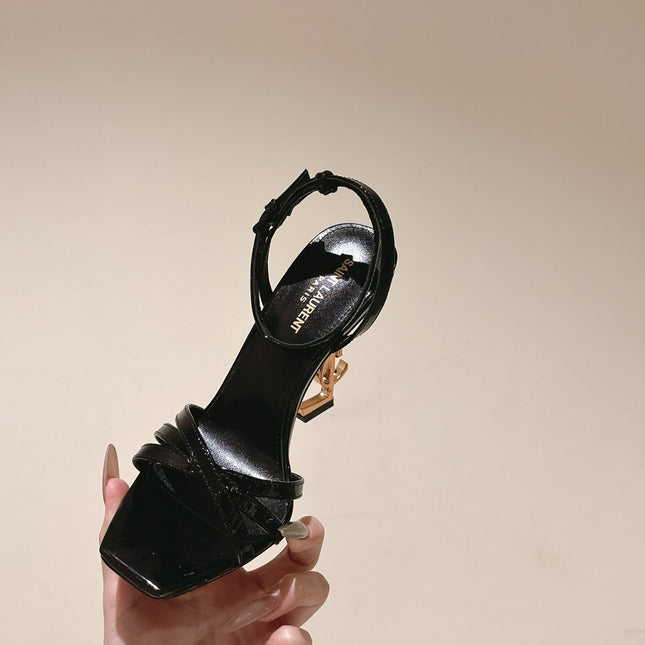 YSL 25S HIGH-HEEL SANDALS 100 MM IN BLACK GLOSSY LAMBSKIN WITH YSL LOGO HEEL DESIGN IN GOLD