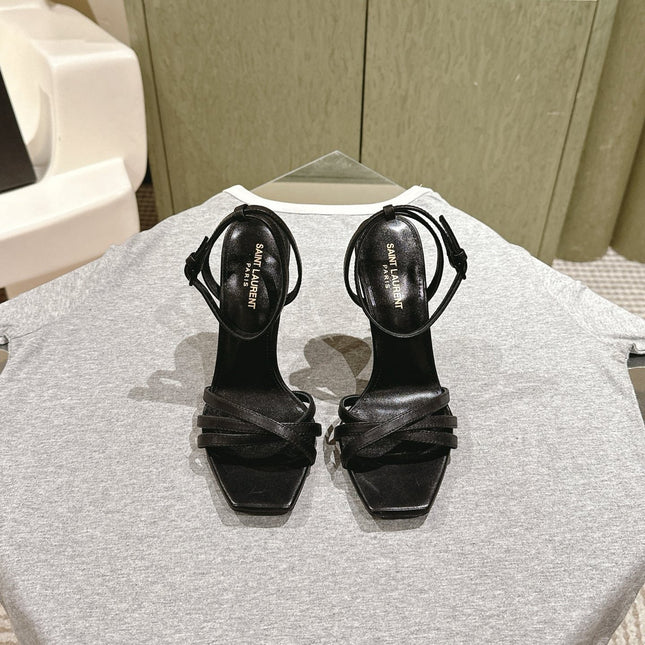 YSL 25S HIGH-HEEL SANDALS 100 MM IN BLACK LAMBSKIN WITH YSL LOGO HEEL DESIGN