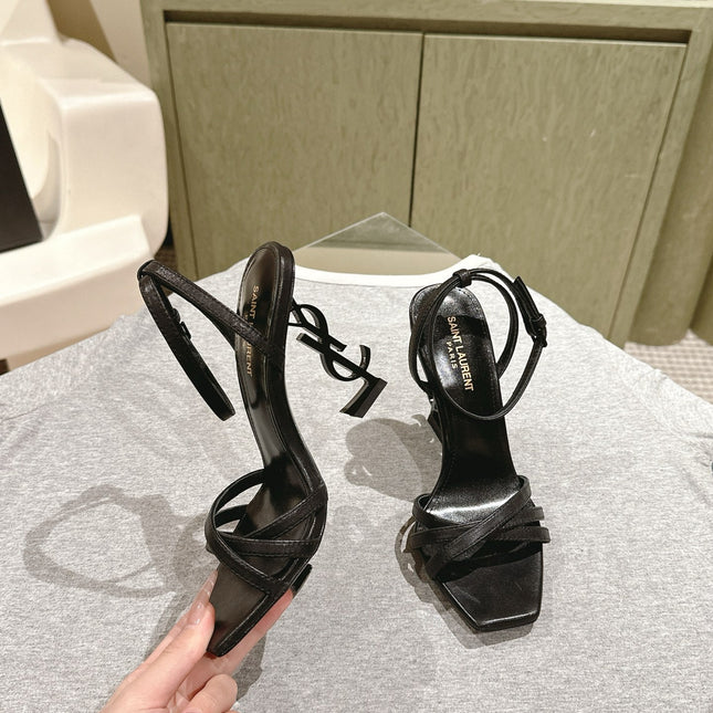YSL 25S HIGH-HEEL SANDALS 100 MM IN BLACK LAMBSKIN WITH YSL LOGO HEEL DESIGN