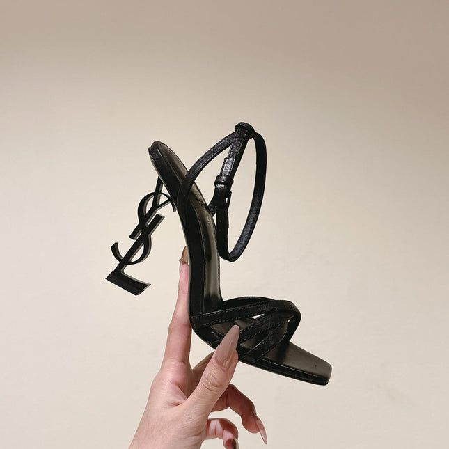 YSL 25S HIGH-HEEL SANDALS 100 MM IN BLACK LAMBSKIN WITH YSL LOGO HEEL DESIGN