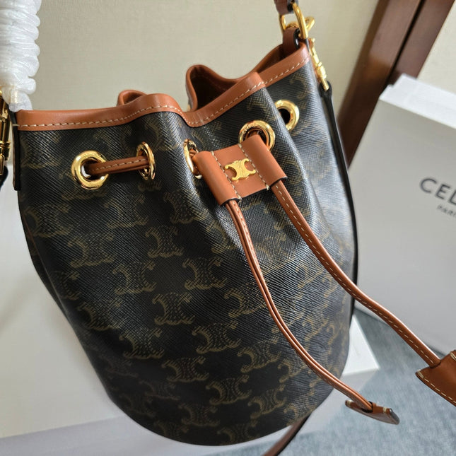 CLARA BAG 19 IN BLACK TRIOMPHE CANVAS AND BROWN CALFSKIN TRIM