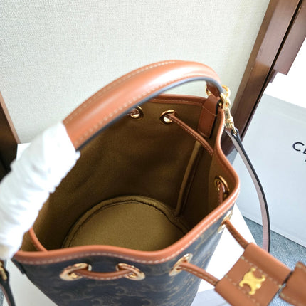 CLARA BAG 19 IN BLACK TRIOMPHE CANVAS AND BROWN CALFSKIN TRIM