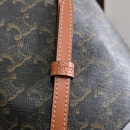 CLARA BAG 19 IN BLACK TRIOMPHE CANVAS AND BROWN CALFSKIN TRIM