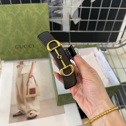 GOLD HORSEBIT CLAW CLIP IN BLACK LAMBSKIN AND RESIN 188103