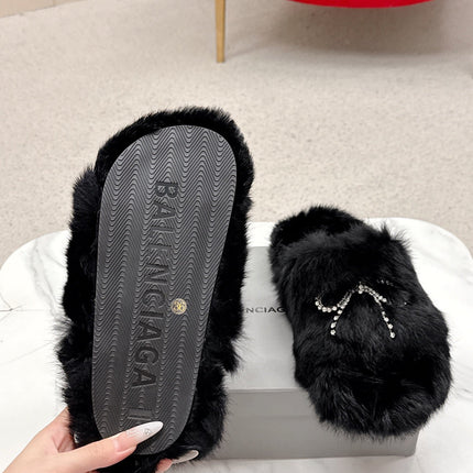 BALENCIAGA 25S SOFT FUR SLIPPERS IN BLACK FUR WITH RHINESTONE BOW