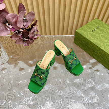 HORSEBIT SLIDE SANDAL IN FOREST GREEN MONOGRAM CANVAS AND SHEEPSKIN LINING