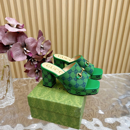 HORSEBIT SLIDE SANDAL IN FOREST GREEN MONOGRAM CANVAS AND SHEEPSKIN LINING