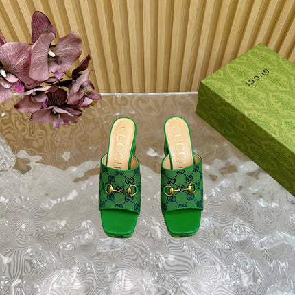 HORSEBIT SLIDE SANDAL IN FOREST GREEN MONOGRAM CANVAS AND SHEEPSKIN LINING